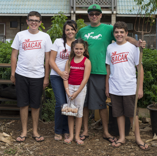 Adoboloco family posed as modern American Gothic